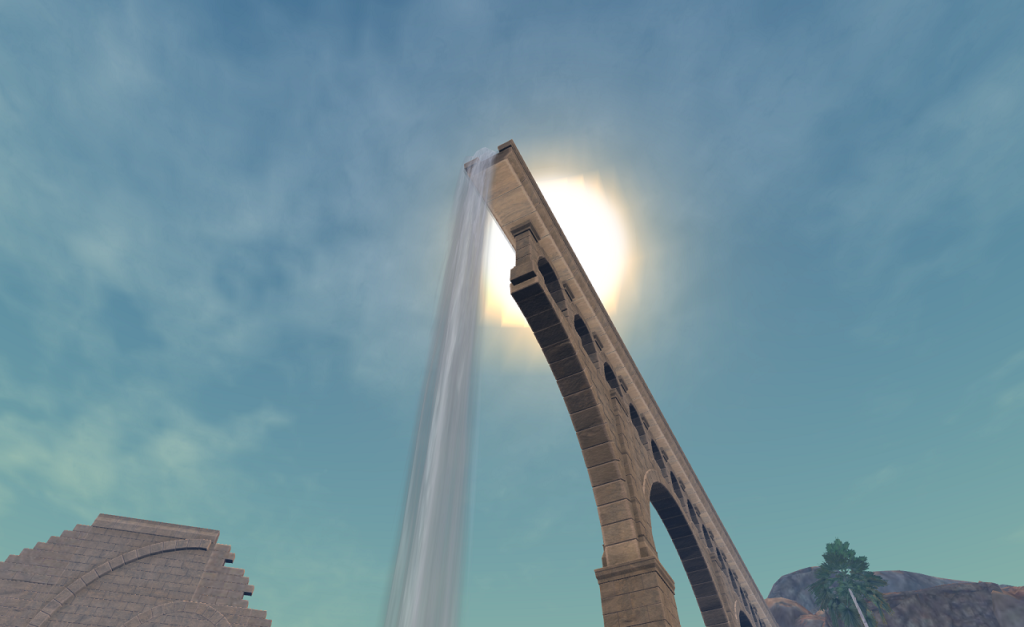 The intense sun beats down from the middle of a blue sky with just a few thin clouds which provide no shelter. The view looks up at the end of an aqueduct high above the viewer. The sun is partly obscured by the end of the aqueduct, which runs from the lower-right of the view to the center. A waterfall streams down from the end of the aqueduct to just left of the center-bottom of the frame. Part of a ruined building is just visible in the lower-left.
