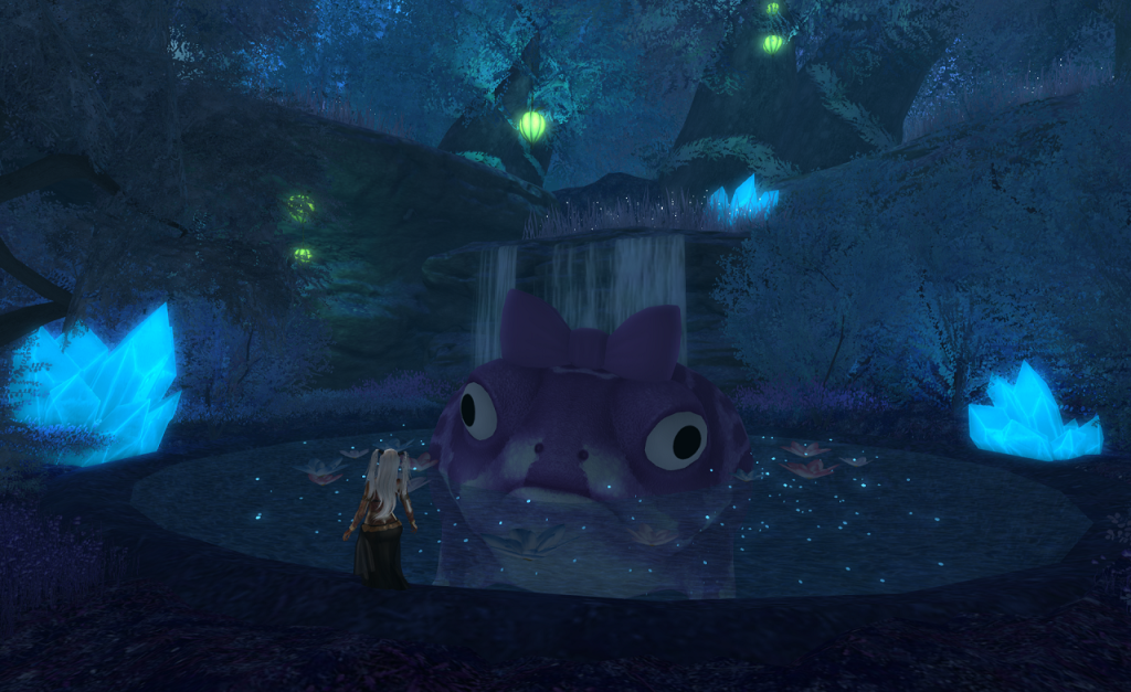 The small figure of a woman with long white hair stands before a dark pool filled with faery lights which is fed from behind by a waterfall. In the middle of the pool, an enormous toad looks back. It is maybe ten feet across, has a purple bow on its head.